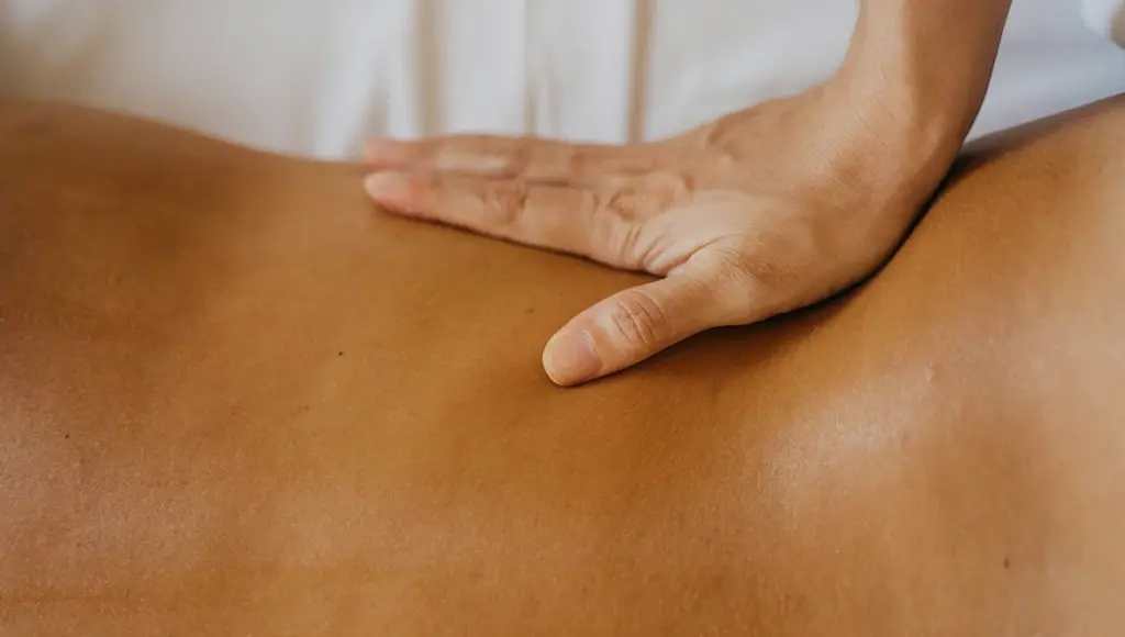 Professional therapist performing body massage at luxury spa in Dhaka